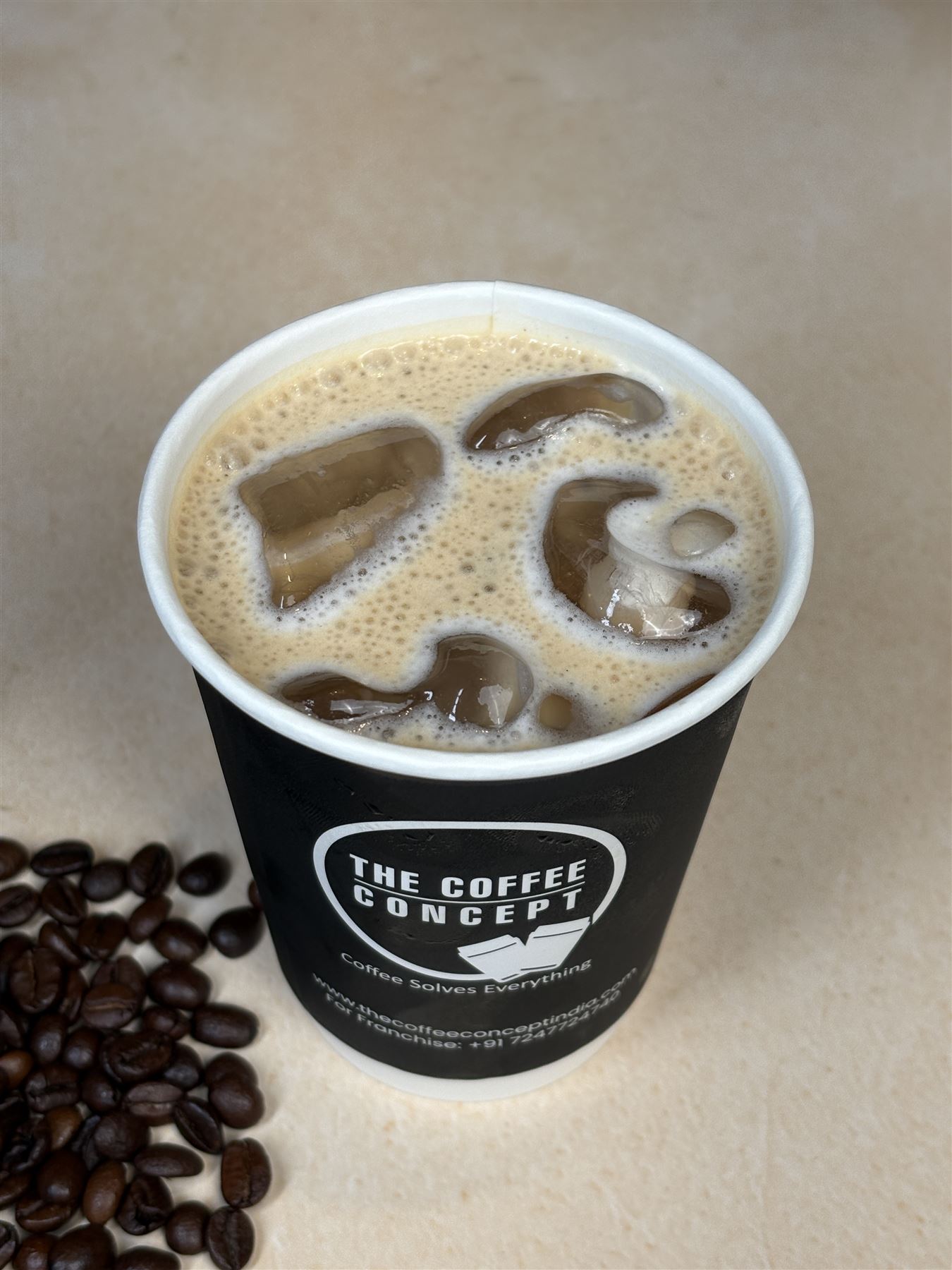 Iced latte in a TCC cup