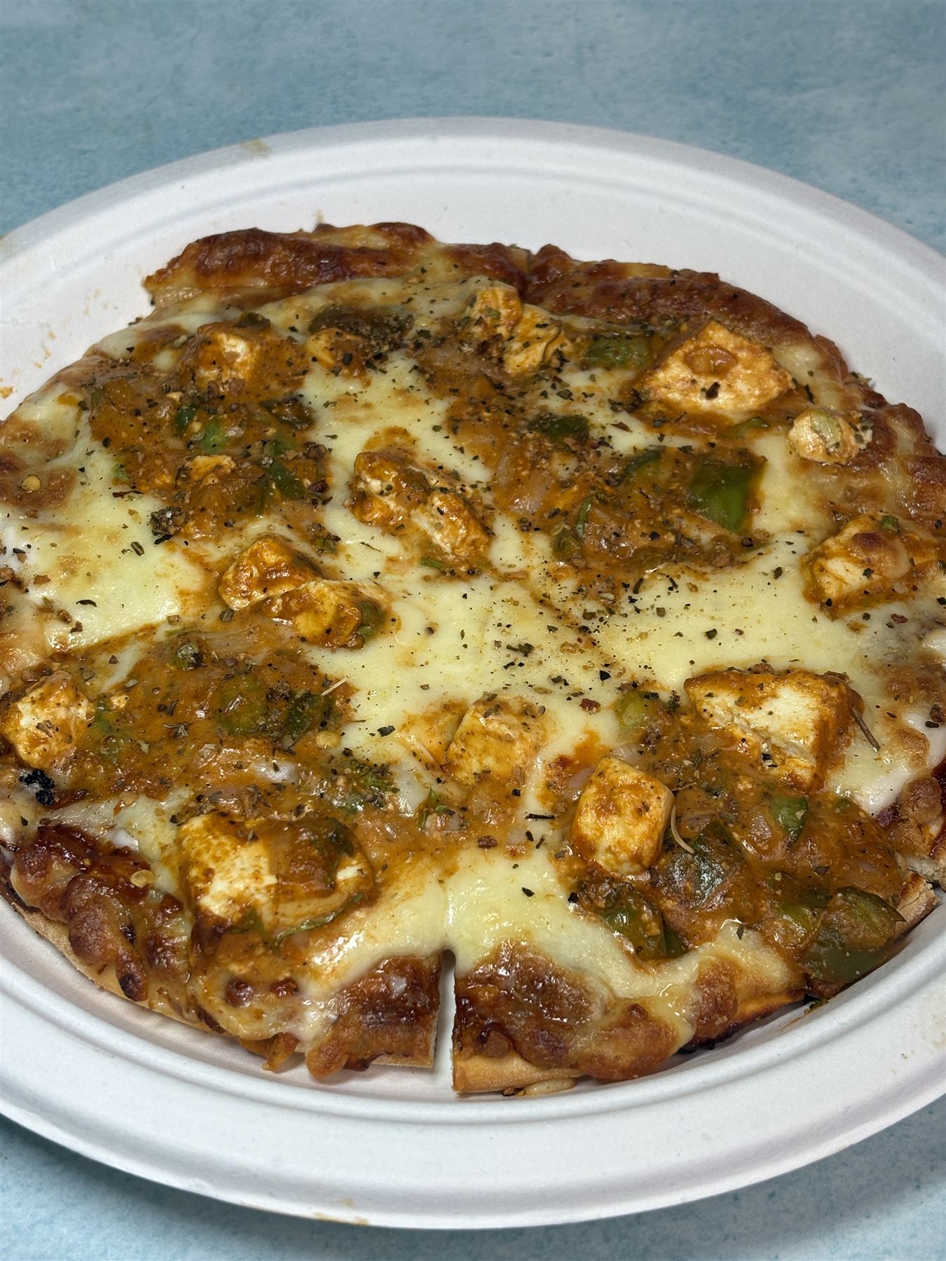 A cheesy paneer pizza